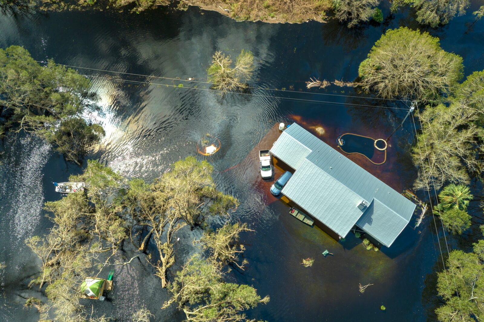 Aftermath of natural disaster. Flooded houses by hurricane Ian rainfall in Florida residential area