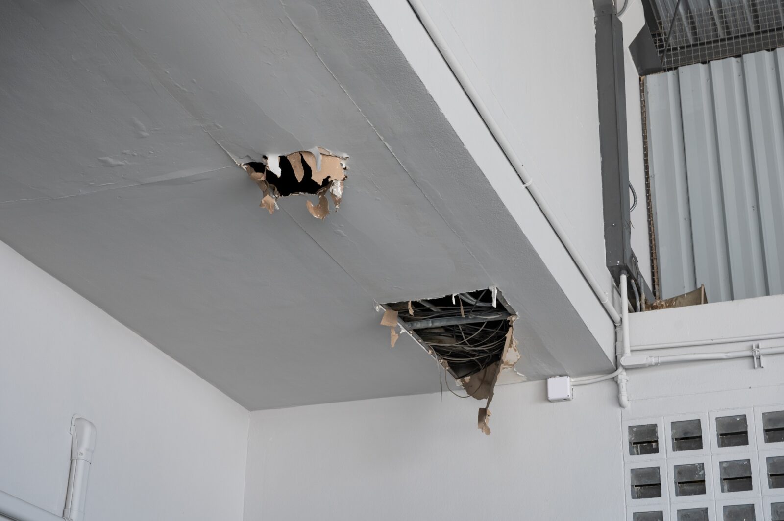Ceiling panel damaged and crack hole with wire system from water leakage